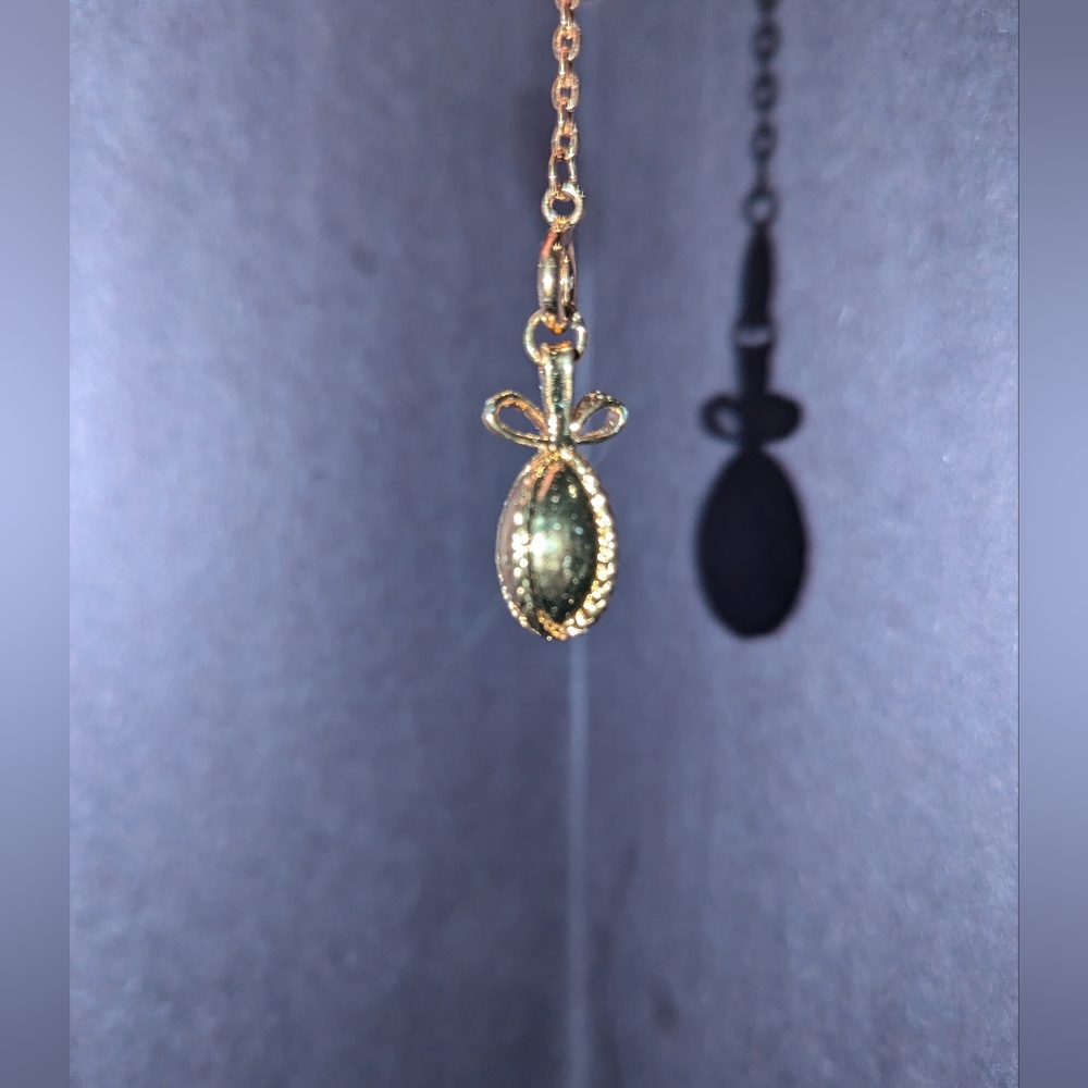 Vintage Joan Rivers egg charm and necklace extender